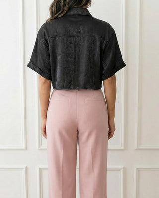 Women wearing a black short-sleeve crop shirt back